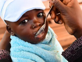 A mother feeding her baby at the Primature health center of San Pedro, in the South West of Côte d’Ivoire. 