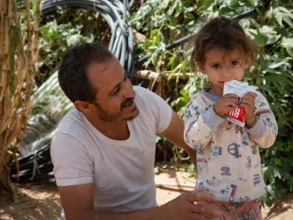 Moharram Al-Oshari, 35 years old, next to his 2 years and a half daughter, says "Before being displaced, I worked as a carpenter and we had a simple life"Mohammed Moharram Sa'ad Al-Oshari lives with his family in a camp for the displaced people in Ahl Al-Jalal in Mareb. Heis fled fighting with his family initially to Al Jawf and then, after Al Jawf was attacked, to Mareb. Although he receives a World Food Programme (WFP) food basket for his family, it is not enough.