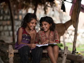 Kanchan (7yrs) and Kashi (7 yr) study at home during the Covid Lockdown . Location : Hindloa Fadia, Limkheda, GujaratLocation : Hindloa Fadia, Limkheda, Gujarat