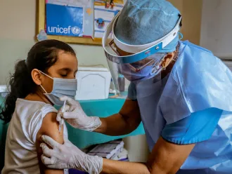 Paulina,10, is vaccinated in a health center located in Bolivar state where UNICEF distributed Polio, Yellow Fever, Tetanus Toxoid and BCG, on July 2, 2020.