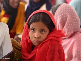 A portrait of a young girl at a Child Friendly Space (CFS) supported by UNICEF in Atbara.