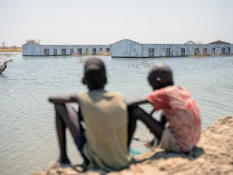 On 4th March 2023, boys look out over their flooded school in Bentiu, Unity State, South Sudan.