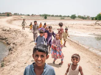 Children seen on the street in the inundated region of Geokaloi Village in the Southern Pakistani province of Sindh.