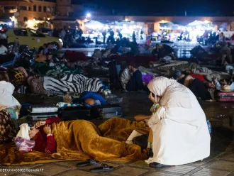 Residents stay out at a square in Marrakesh on September 9, 2023, after an earthquake.