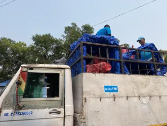 On 4 Nov 2023, UNICEF staff at the field office in Nepalgunj in Banke District load relief supplies onto a truck headed for Jajarkot District.