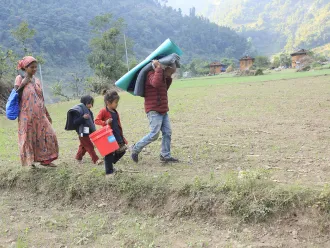 On 6 November 2023, in Aathbiskot Municipality in Rukum West District – in one of the communities most affected by the 6.4 magnitude quake that hit western Nepal on 3 November – a family of four receive relief supplies distributed by UNICEF in coordination with local authorities.
