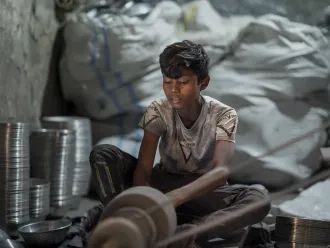 A child works in small silver polishing factory in Bangladesh