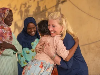 UNICEF Executive Director Catherine Russell hugs 11-year-old Yomna after meeting with her and other adolescent girls displaced by the war, at Abdullah Naj internally displaced people's gathering point in Port Sudan.