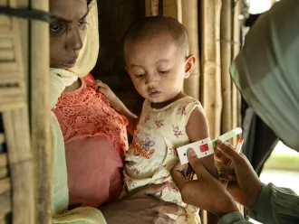 A child being screened for malnutrition in Cox’s Bazar, Bangladesh.