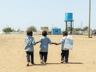 Children walk back home from a UNICEF-supported child friendly space in Al Houri internally displaced people’s (IDP) camp in Gedaref State.