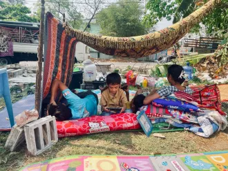 Children and families take shelter in makeshift outdoor spaces in Mandalay, Myanmar, following the devastating 7.7 magnitude earthquake that struck on 28 March 2025.