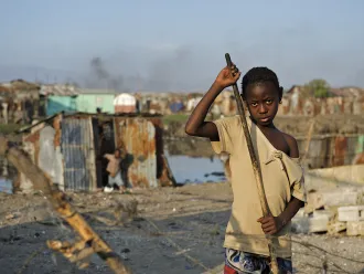 On 6 February, Luisnez, 10, sweeps away garbage and debris in front of her destroyed home, in Cité Soleil, one of the poorest neighbourhoods in Port-au-Prince, the capital. Together with three younger siblings and her mother, Luisnez is among many who sleep outdoors, or in makeshift tents, because their homes were damaged or destroyed during the earthquake or because they fear additional aftershocks “I don’t know what happened,” she said. “I was playing outside and everything started to fall."