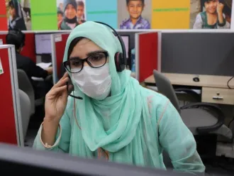 A community volunteer at the helpline offices.