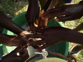 Children wash their hands at a school WASH club