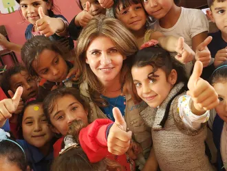 Bayan with students at a makani centre